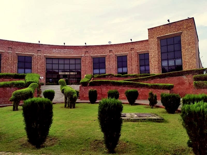 JNU Convention Centre with trimmed hedges